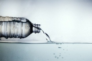 Best Water to Drink - water poured out of a bottle pic