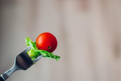 Breast Cancer and Diet: What's the Connection? - tomato with basil leaf on fork pic