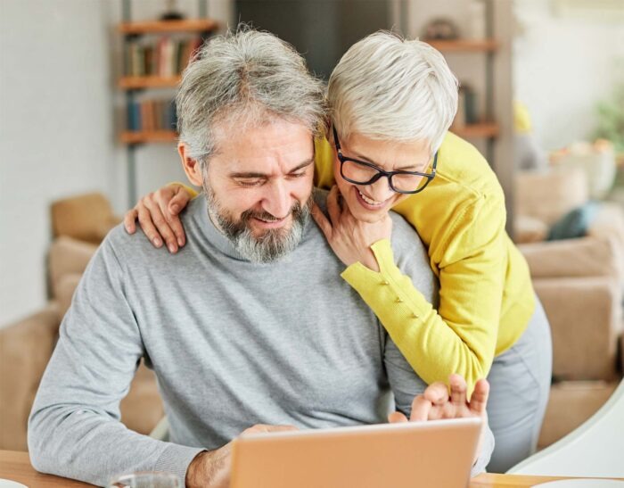 a couple using a laptop